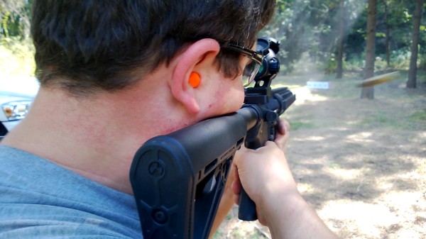 Kyle firing his newly-built AR-15 at one of the many shooting spots on the property