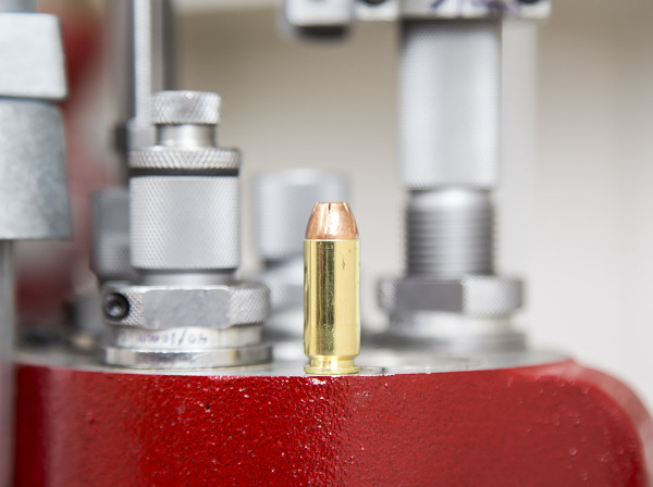 10mm cartridge next to shimmed 40/10mm dies - Image copyright Ultimate Reloader
